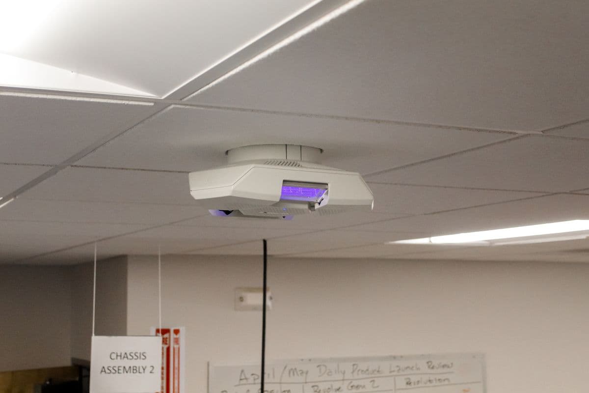 A Lumenizer unit on the ceiling of a meeting room