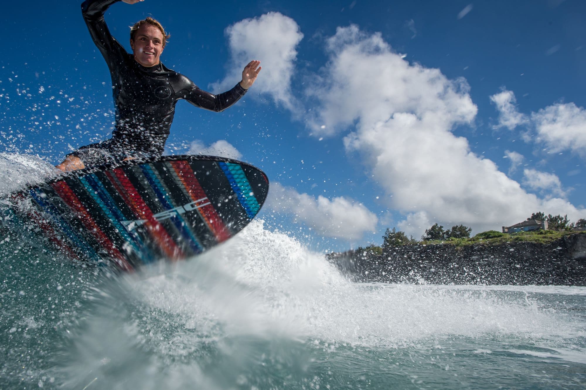 A rider launching off the lip of a wave