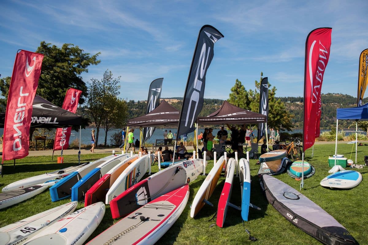 Race boards and flags in the Gorge Paddle Challenge event village