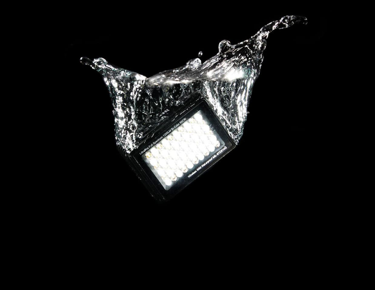 A Litra light splashing into water, shot in-house