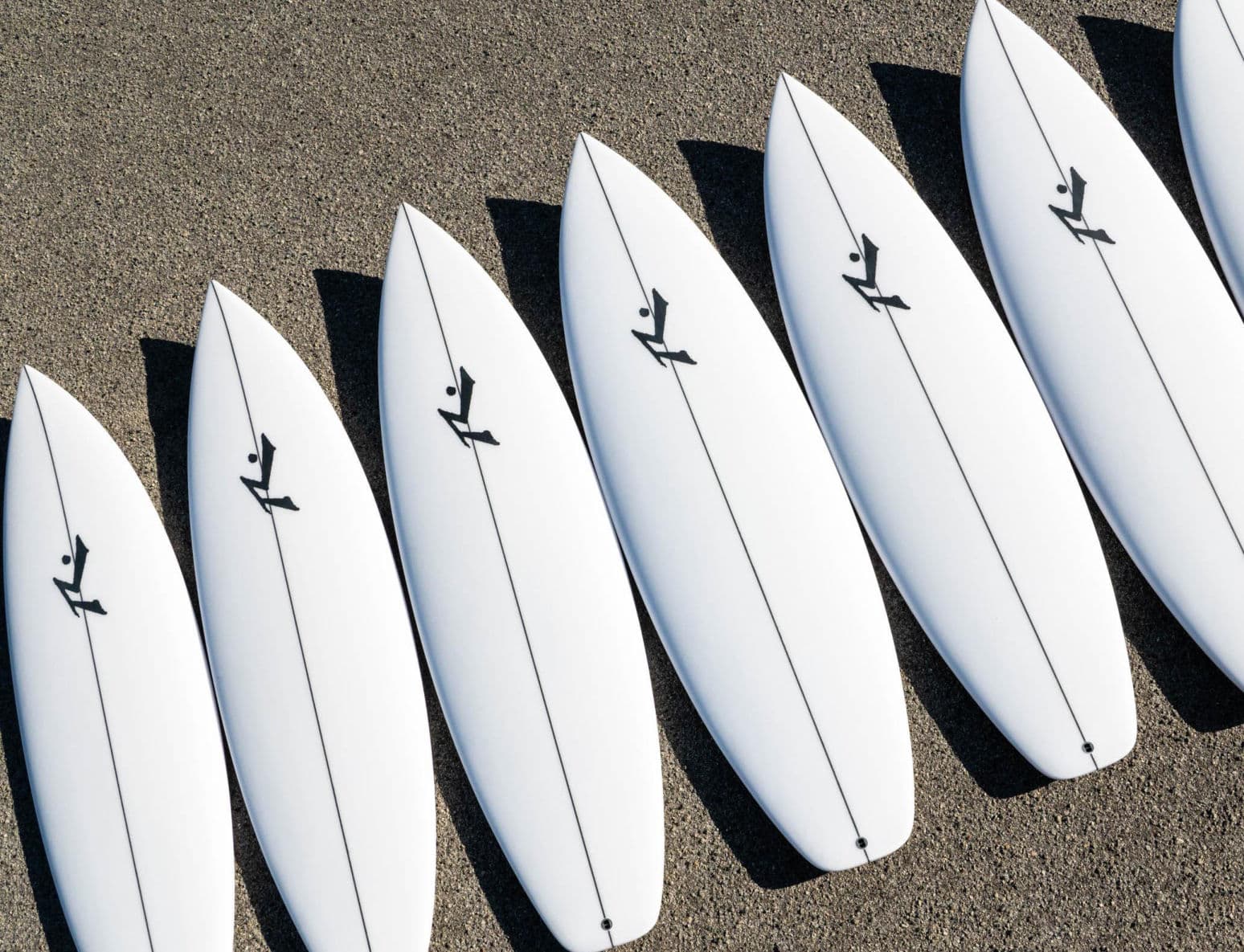 A row of Rusty shortboards